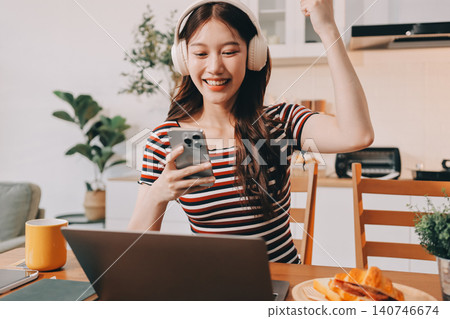 Asian woman using computer remote for business studying, watching online virtual webinar training meeting, video call. asian business woman talking on laptop in home office. Banner, copy space Asian woman using computer remote for business studying, watching online virtual webinar training meeting, video call. asian business woman talking on laptop in home office. Banner, copy space 140746674