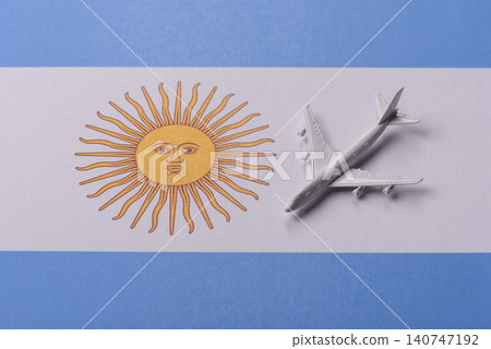 Airplane on the Argentine flag as a conceptual backdrop for flights. Airplane on the Argentine flag Airplane on the Argentine flag as a conceptual backdrop for flights. Airplane on the Argentine flag 140747192