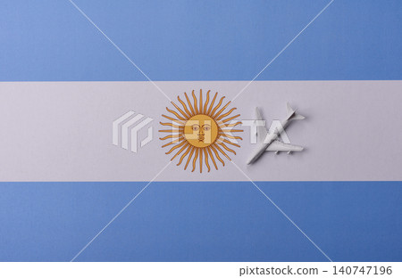 Airplane on the Argentine flag as a conceptual backdrop for flights. Airplane on the Argentine flag Airplane on the Argentine flag as a conceptual backdrop for flights. Airplane on the Argentine flag 140747196