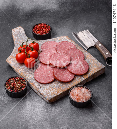 Slices of smoked salami or pepperoni for making sandwiches or pizza at home. Sausage slices Slices of smoked salami or pepperoni for making sandwiches or pizza at home. Sausage slices 140747448