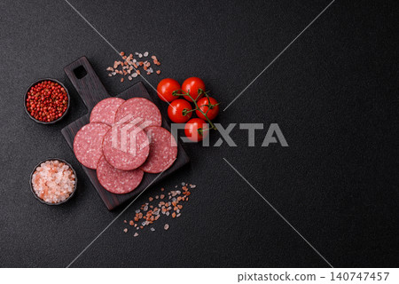 Slices of smoked salami or pepperoni for making sandwiches or pizza at home. Sausage slices Slices of smoked salami or pepperoni for making sandwiches or pizza at home. Sausage slices 140747457
