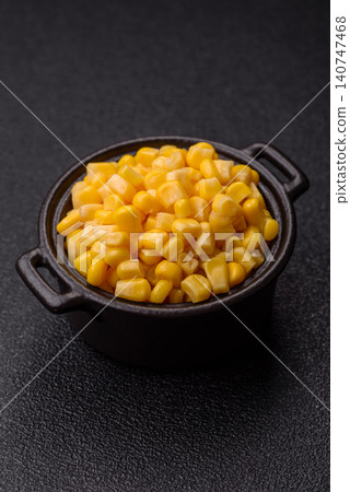 Golden, sweet canned corn kernels or maize for salads and vegetarian dishes. Canned corn Golden, sweet canned corn kernels or maize for salads and vegetarian dishes. Canned corn 140747468