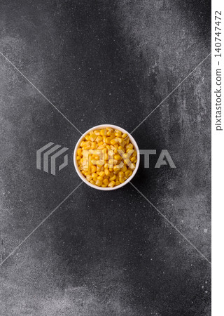 Golden, sweet canned corn kernels or maize for salads and vegetarian dishes. Canned corn Golden, sweet canned corn kernels or maize for salads and vegetarian dishes. Canned corn 140747472