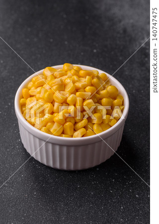 Golden, sweet canned corn kernels or maize for salads and vegetarian dishes. Canned corn Golden, sweet canned corn kernels or maize for salads and vegetarian dishes. Canned corn 140747475