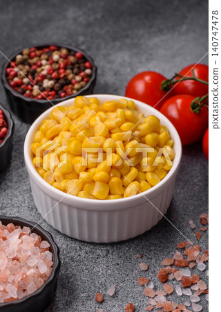 Golden, sweet canned corn kernels or maize for salads and vegetarian dishes. Canned corn Golden, sweet canned corn kernels or maize for salads and vegetarian dishes. Canned corn 140747478