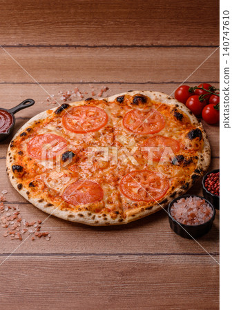 Italian pizza margherita with cheese, tomatoes, and tomato sauce, fast food. Pizza margherita Italian pizza margherita with cheese, tomatoes, and tomato sauce, fast food. Pizza margherita 140747610