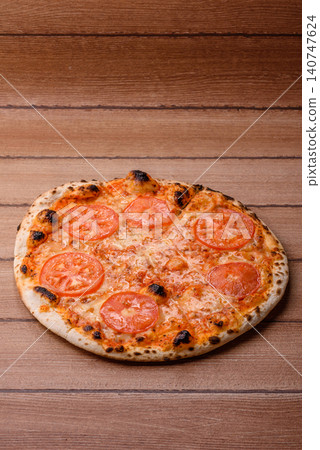 Italian pizza margherita with cheese, tomatoes, and tomato sauce, fast food. Pizza margherita 140747624