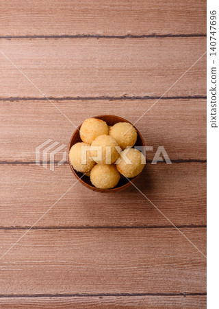 Cheese balls or potato croquettes, golden brown, fried with salt and spices. Cheese balls 140747696