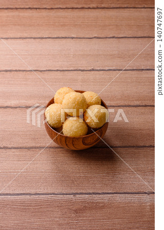 Cheese balls or potato croquettes, golden brown, fried with salt and spices. Cheese balls Cheese balls or potato croquettes, golden brown, fried with salt and spices. Cheese balls 140747697