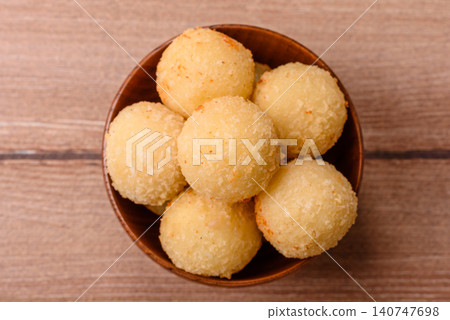 Cheese balls or potato croquettes, golden brown, fried with salt and spices. Cheese balls Cheese balls or potato croquettes, golden brown, fried with salt and spices. Cheese balls 140747698