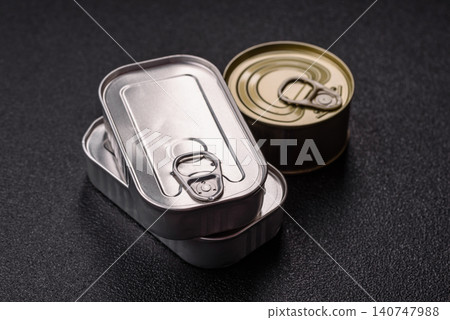 A metal tin can of meat, fish, or dog or cat food. A tin can of food A metal tin can of meat, fish, or dog or cat food. A tin can of food 140747988