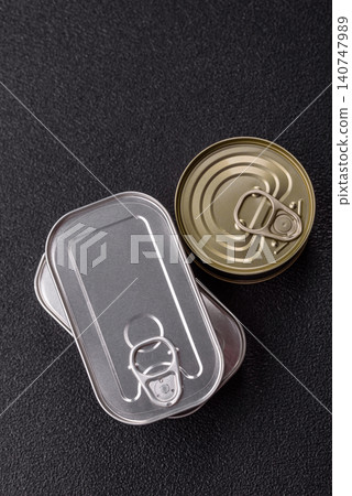 A metal tin can of meat, fish, or dog or cat food. A tin can of food A metal tin can of meat, fish, or dog or cat food. A tin can of food 140747989