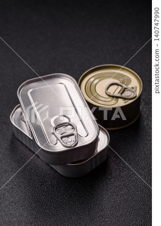 A metal tin can of meat, fish, or dog or cat food. A tin can of food A metal tin can of meat, fish, or dog or cat food. A tin can of food 140747990