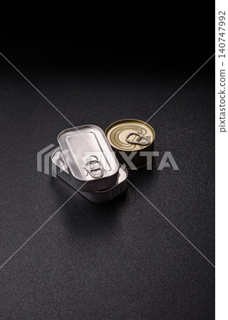 A metal tin can of meat, fish, or dog or cat food. A tin can of food 140747992