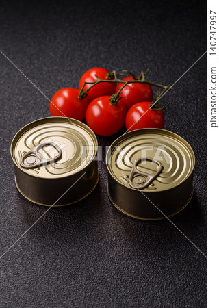 A metal tin can of meat, fish, or dog or cat food. A tin can of food A metal tin can of meat, fish, or dog or cat food. A tin can of food 140747997