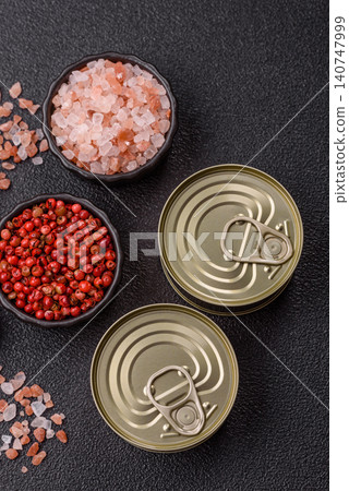 A metal tin can of meat, fish, or dog or cat food. A tin can of food 140747999