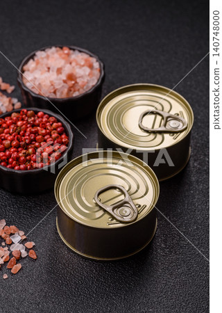 A metal tin can of meat, fish, or dog or cat food. A tin can of food 140748000
