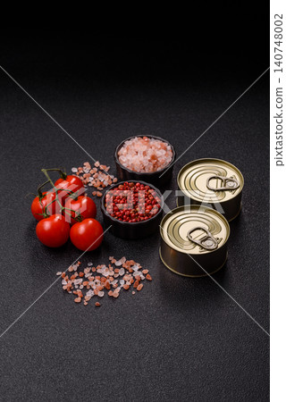 A metal tin can of meat, fish, or dog or cat food. A tin can of food A metal tin can of meat, fish, or dog or cat food. A tin can of food 140748002