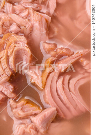 Fish, canned tuna chunks in brine for sandwiches and salads. Canned tuna Fish, canned tuna chunks in brine for sandwiches and salads. Canned tuna 140748004