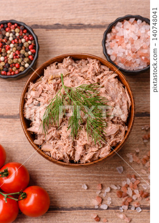 Fish, canned tuna chunks in brine for sandwiches and salads. Canned tuna 140748041