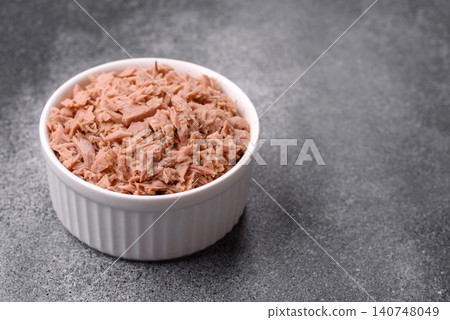 Fish, canned tuna chunks in brine for sandwiches and salads. Canned tuna Fish, canned tuna chunks in brine for sandwiches and salads. Canned tuna 140748049