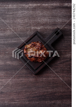 Beef mignon steak, rare, meat grilled with salt and spices. Beef steak Beef mignon steak, rare, meat grilled with salt and spices. Beef steak 140748292