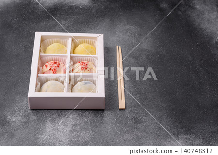 Japanese sweet frozen mochi with rice dough, fruit, and chocolate filling. Japanese mochi Japanese sweet frozen mochi with rice dough, fruit, and chocolate filling. Japanese mochi 140748312