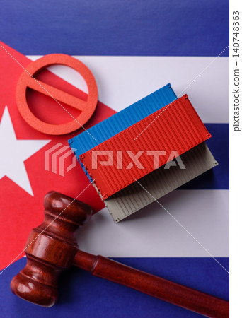 The cargo container ban on the Cuba flag as a conceptual backdrop. The cargo container embargo 140748363