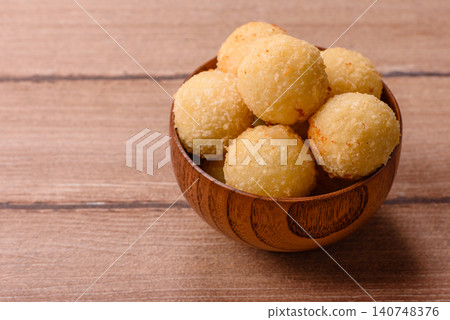 Cheese balls or potato croquettes, golden brown, fried with salt and spices. Cheese balls Cheese balls or potato croquettes, golden brown, fried with salt and spices. Cheese balls 140748376