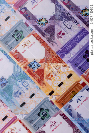 Qatar paper money, the Qatari riyal as a tool for financial transactions and trade. Qatari money Qatar paper money, the Qatari riyal as a tool for financial transactions and trade. Qatari money 140748491