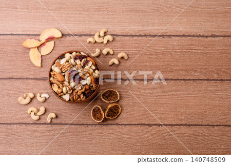 A mix of pistachios, hazelnuts, walnuts, peanuts, dried berries, and fruits. A mix of nuts 140748509