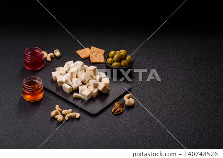 White feta, tofu, or mozzarella cheese cubes with herbs. White mozzarella cheese 140748526
