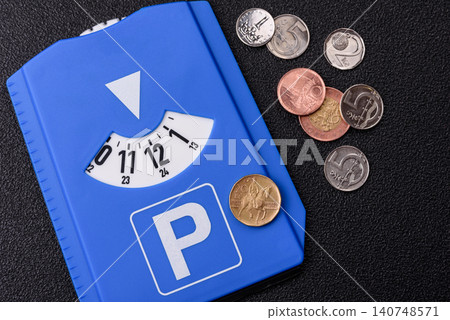 A parking disc, permit, or ticket for measuring time and paying municipal services. A parking disc A parking disc, permit, or ticket for measuring time and paying municipal services. A parking disc 140748571