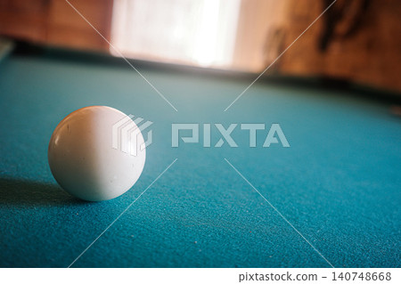 White Billiard Ball On Blue Pool Table White Billiard Ball On Blue Pool Table 140748668