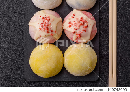 Japanese sweet frozen mochi with rice dough, fruit, and chocolate filling. Japanese mochi Japanese sweet frozen mochi with rice dough, fruit, and chocolate filling. Japanese mochi 140748693