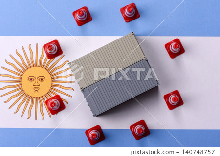 The cargo container ban on the Argentina flag as a conceptual backdrop. The cargo container embargo The cargo container ban on the Argentina flag as a conceptual backdrop. The cargo container embargo 140748757