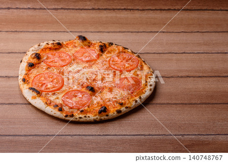 Italian pizza margherita with cheese, tomatoes, and tomato sauce, fast food. Pizza margherita Italian pizza margherita with cheese, tomatoes, and tomato sauce, fast food. Pizza margherita 140748767