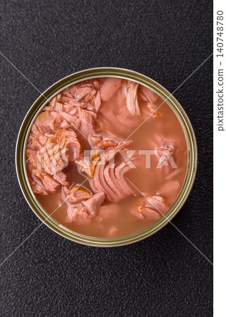 Fish, canned tuna chunks in brine for sandwiches and salads. Canned tuna 140748780