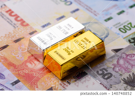 Gold and silver bullion or ingots as metals for bank storage, investments. Gold and silver bars Gold and silver bullion or ingots as metals for bank storage, investments. Gold and silver bars 140748852