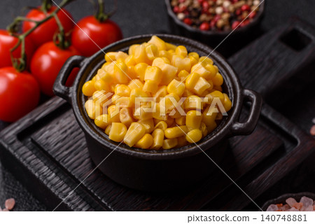Golden, sweet canned corn kernels or maize for salads and vegetarian dishes. Canned corn Golden, sweet canned corn kernels or maize for salads and vegetarian dishes. Canned corn 140748881