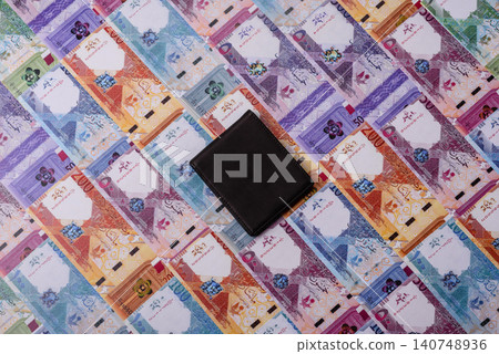 Qatar, Qatari riyal, paper money and coins, financing and commodity exchange, trade. Qatari currency Qatar, Qatari riyal, paper money and coins, financing and commodity exchange, trade. Qatari currency 140748936