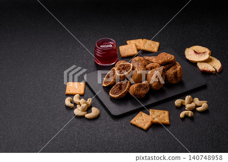Dried whole fig as an ingredient for sweet desserts. Dried figs Dried whole fig as an ingredient for sweet desserts. Dried figs 140748958