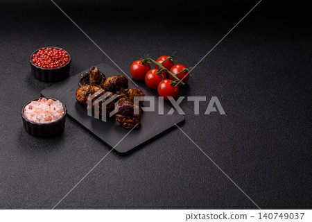 Grilled or barbecued mushroom halves with salt and spices. Grilled mushrooms Grilled or barbecued mushroom halves with salt and spices. Grilled mushrooms 140749037