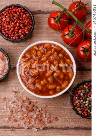 Beans in tomato sauce, a canned stew for the dinner table. Beans in tomato sauce 140749051