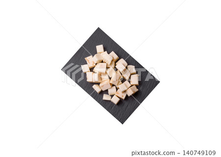 White feta, tofu, or mozzarella cheese cubes with herbs. White mozzarella cheese White feta, tofu, or mozzarella cheese cubes with herbs. White mozzarella cheese 140749109