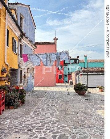 Cobblestone alleys and colorful streets of Burano Island, Venice, Italy Cobblestone alleys and colorful streets of Burano Island, Venice, Italy 140749308