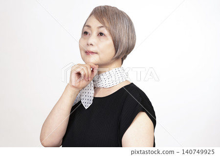 Studio portrait photography of a senior woman, white background. Studio portrait photography of a senior woman, white background. 140749925