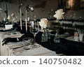 Top view of luxury dark and moody table decor for a fine dining event or reception 140750482