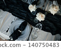 Top view of luxury dark and moody table decor for a fine dining event or reception 140750483