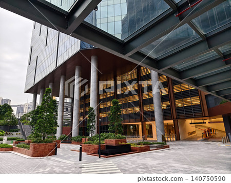 Ground level plaza with columned entrance, inviting steps and greenery frame office lobby. Ground level plaza with columned entrance, inviting steps and greenery frame office lobby. 140750590